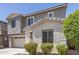 Charming two-story home with a two-car garage, gray stucco, and stone accents at 3710 E Cheery Lynn Rd, Phoenix, AZ 85018