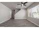 Open-concept living room with tile floors, staircase, and neutral walls at 3710 E Cheery Lynn Rd, Phoenix, AZ 85018