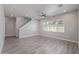Open-concept living room with tile floors and a large window for natural light at 3710 E Cheery Lynn Rd, Phoenix, AZ 85018