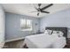 Bedroom featuring a ceiling fan, a large window, neutral carpet, and comfortable furniture at 3825 E Camelback Rd # 152, Phoenix, AZ 85018