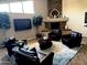 Clubhouse with lounge chairs, a TV, and a stone fireplace at 3825 E Camelback Rd # 152, Phoenix, AZ 85018