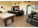 Open clubhouse with a pool table, kitchen with seating, and comfortable seating area at 3825 E Camelback Rd # 152, Phoenix, AZ 85018