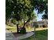 Clubhouse sign with landscaping and a glimpse of the pool at 3825 E Camelback Rd # 152, Phoenix, AZ 85018