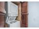 Convenient in-unit laundry closet with stacked washer and dryer and plenty of cabinet space at 3825 E Camelback Rd # 152, Phoenix, AZ 85018