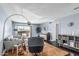 Stylish living room with hardwood floors, light blue walls, a ceiling fan, and sliding glass doors to a patio at 3825 E Camelback Rd # 152, Phoenix, AZ 85018