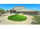 Lush backyard featuring a well-maintained lawn surrounded by desert landscaping, perfect for outdoor enjoyment and relaxation at 3903 E Melody Dr, Phoenix, AZ 85042