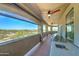 Expansive covered balcony featuring an outdoor kitchen with sink and grill, along with scenic views of the surrounding landscape at 3903 E Melody Dr, Phoenix, AZ 85042