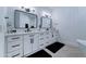 Modern bathroom with black fixtures, double sink vanity and luxurious finishes at 3903 E Melody Dr, Phoenix, AZ 85042