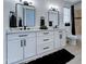 Elegant bathroom features a double vanity, black fixtures, and stylish decor for a touch of luxury at 3903 E Melody Dr, Phoenix, AZ 85042