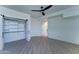 Bright bedroom boasts a ceiling fan and a large closet, perfect for storage and convenience at 3903 E Melody Dr, Phoenix, AZ 85042