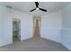 Bright bedroom features sleek ceiling fan and provides easy access to other rooms in the house at 3903 E Melody Dr, Phoenix, AZ 85042
