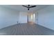 View of the spacious bedroom featuring ensuite bathroom and modern ceiling fan at 3903 E Melody Dr, Phoenix, AZ 85042