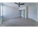 Bright bedroom features sleek ceiling fan and large closet for optimal storage and comfort at 3903 E Melody Dr, Phoenix, AZ 85042