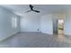 This bedroom is complete with wood floors, ceiling fan and ensuite bathroom at 3903 E Melody Dr, Phoenix, AZ 85042