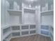 Massive walk-in closet with custom shelving and storage at 3903 E Melody Dr, Phoenix, AZ 85042