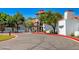 Elegant clubhouse with red tile roof, lush landscaping, and welcoming entrance at 3903 E Melody Dr, Phoenix, AZ 85042