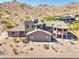 Exterior aerial view of the spacious home with landscaped desert surroundings, offering privacy and stunning natural beauty at 3903 E Melody Dr, Phoenix, AZ 85042