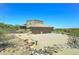 Spacious garage with a wide driveway and desert landscape surrounding this home at 3903 E Melody Dr, Phoenix, AZ 85042