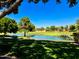 Picturesque golf course featuring a tranquil pond with stone bridges and lush greenery at 3903 E Melody Dr, Phoenix, AZ 85042