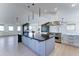 Modern eat-in kitchen featuring a large island, stainless appliances, and plenty of natural light at 3903 E Melody Dr, Phoenix, AZ 85042