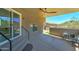 Covered patio with ceiling fan, offering a cozy outdoor seating area and convenient access to the backyard at 3903 E Melody Dr, Phoenix, AZ 85042
