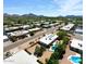 A view of the neighborhood showing the houses and pools, as well as a mountain view in the distance at 4032 E Cannon Dr, Phoenix, AZ 85028