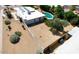 Aerial view of the home's backyard with a pool and simple desert landscape at 4032 E Cannon Dr, Phoenix, AZ 85028