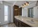 Spacious bathroom with double sinks, ample lighting, and a shower/tub combo at 4032 E Cannon Dr, Phoenix, AZ 85028