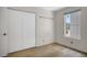 Bright bedroom includes closet space, window, and neutral tones for a peaceful retreat at 4032 E Cannon Dr, Phoenix, AZ 85028