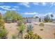 Property exterior with xeriscape landscaping, including agave, yucca, and other desert plants at 4032 E Cannon Dr, Phoenix, AZ 85028