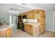 Well-equipped kitchen featuring modern appliances, wooden cabinets, and a view of the living area at 4032 E Cannon Dr, Phoenix, AZ 85028