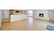 Open-concept living space with fireplace, tile flooring, and an open kitchen with breakfast bar at 4032 E Cannon Dr, Phoenix, AZ 85028