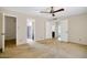 Spacious main bedroom featuring neutral carpet and multiple entry doors at 4032 E Cannon Dr, Phoenix, AZ 85028