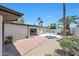 A brick paver patio and desert landscaping make for a cozy backyard at 4079 E Yucca St, Phoenix, AZ 85028