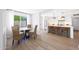 Bright dining room connects to the kitchen area, showcasing modern decor and ample natural light at 4079 E Yucca St, Phoenix, AZ 85028