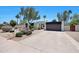 Inviting home exterior featuring desert landscaping and an arched entry to the front door at 4079 E Yucca St, Phoenix, AZ 85028