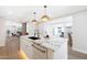 Elegant kitchen featuring a marble island with pendant lighting, an undermounted sink, and stainless appliances at 4079 E Yucca St, Phoenix, AZ 85028