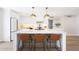 Kitchen featuring a large marble island with pendant lighting and barstool seating at 4079 E Yucca St, Phoenix, AZ 85028