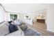 Bright living room connects to the kitchen area, showcasing modern decor and ample natural light at 4079 E Yucca St, Phoenix, AZ 85028