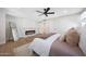 Bright main bedroom featuring a modern fireplace, ensuite bathroom, and ample closet space at 4079 E Yucca St, Phoenix, AZ 85028