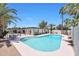 Sparkling blue pool surrounded by palm trees, a patio, and a fenced yard at 4079 E Yucca St, Phoenix, AZ 85028