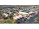Aerial shot showcases community amenities: tennis courts, pool, and recreation center at 4151 E Clovis Ave, Mesa, AZ 85206