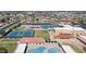 Expansive aerial view showcasing tennis courts, pool, and community recreational area at 4151 E Clovis Ave, Mesa, AZ 85206