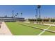 Well-maintained community bocce courts feature synthetic turf and shaded bench seating at 4151 E Clovis Ave, Mesa, AZ 85206
