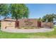 Landscaped Sunland Village Golf Club entrance featuring desert plants and a welcoming sign at 4151 E Clovis Ave, Mesa, AZ 85206