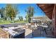Inviting outdoor patio with comfortable seating, tables, and a view of the golf course at 4151 E Clovis Ave, Mesa, AZ 85206