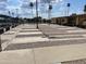 View of community shuffleboard courts featuring marked lanes and seating at 4151 E Clovis Ave, Mesa, AZ 85206