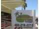 Rochester's Gathering Dining & Sports Bar with a sign featuring palm trees and a golf flag at 4151 E Clovis Ave, Mesa, AZ 85206