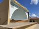 Outdoor stage at Sunland Village with desert mural for community events at 4151 E Clovis Ave, Mesa, AZ 85206