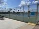 View of tennis court showcasing fencing, seating, and court rules for players at 4151 E Clovis Ave, Mesa, AZ 85206